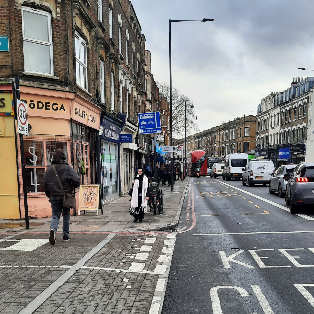 A busy main road in Clapton lined with shops